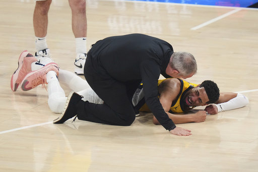 Indiana Pacers guard Tyrese Haliburton lays on the court 