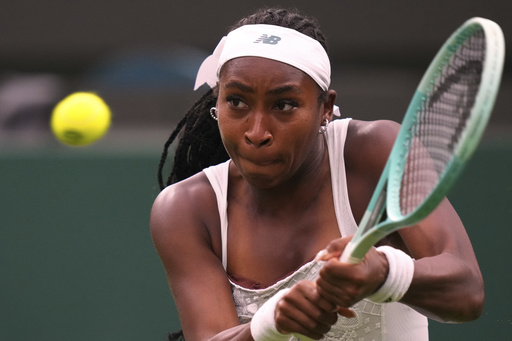 Coco Gauff of the U.S. returns the ball to Dayana Yastremska of Ukraine during their first round women's single match at the Wimbledon Tennis Championships in London, Tuesday, July 1, 2025.(AP Photo/Kirsty Wigglesworth)