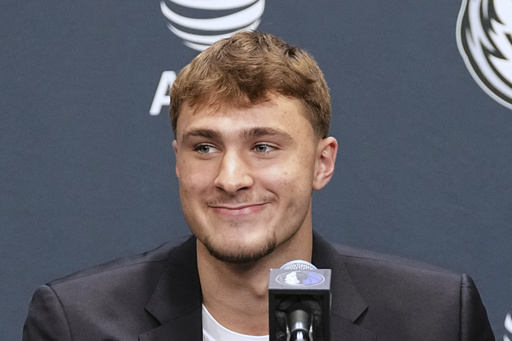 Dallas Mavericks' Cooper Flagg, the No. 1 overall pick in the NBA draft, takes questions during an NBA basketball press conference at the team's practice facility, Friday, June 27, 2025, in Dallas. (AP Photo/Tony Gutierrez)
